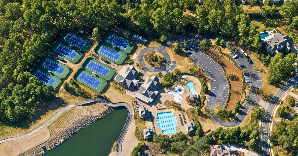 Aerial view of The River Club tennis courts and community pools.
