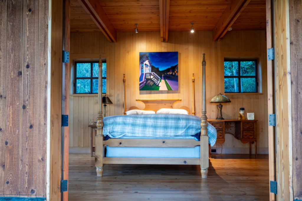 The interiors open to exposed wood ceilings with visible beams