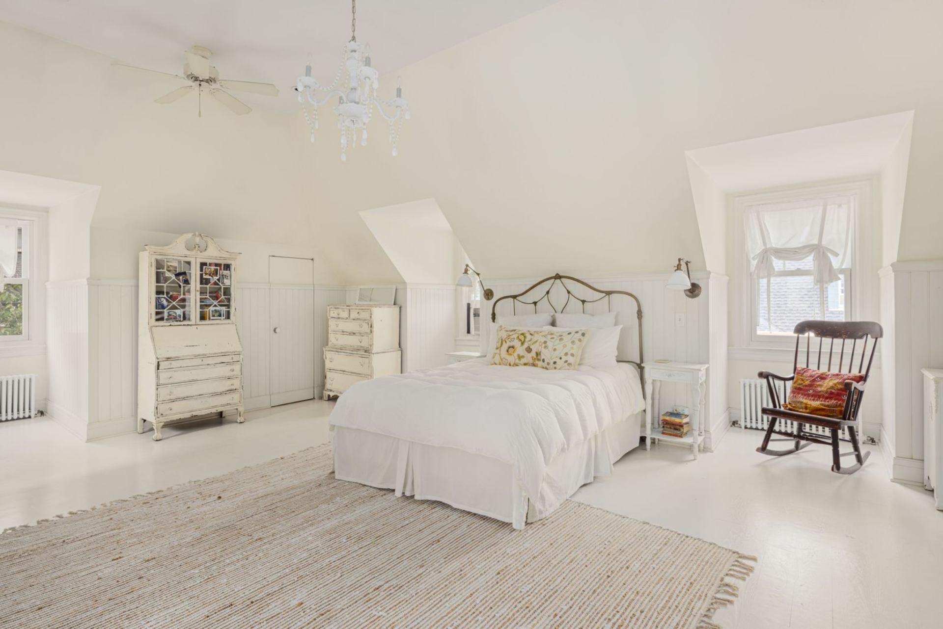 Loft-like suite with angled ceilings and three exposures that bring in light from multiple directions.