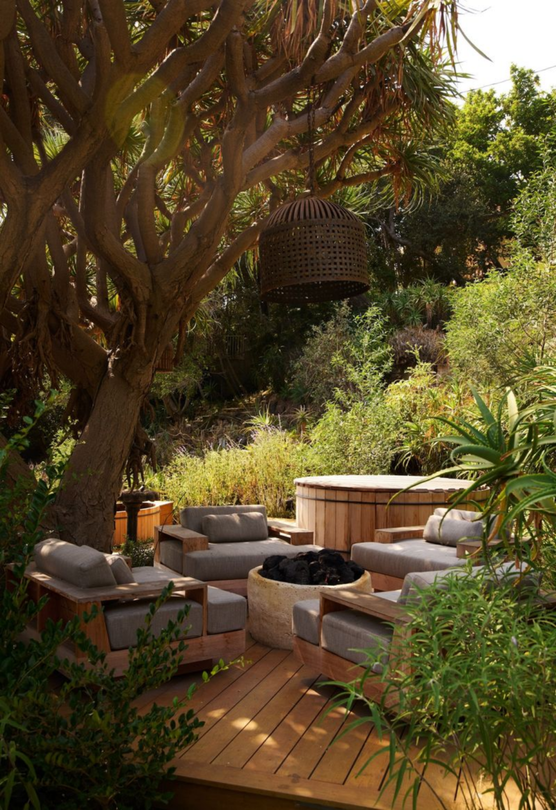 Up in the trees, another lounge consists of a fire pit, a hot tub, and a cold plunge.