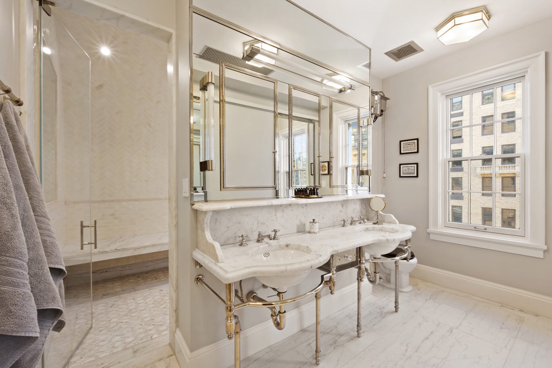 The en-suite bath is designed as a true escape, modeled after a Turkish bath and finished almost entirely in marble. 
