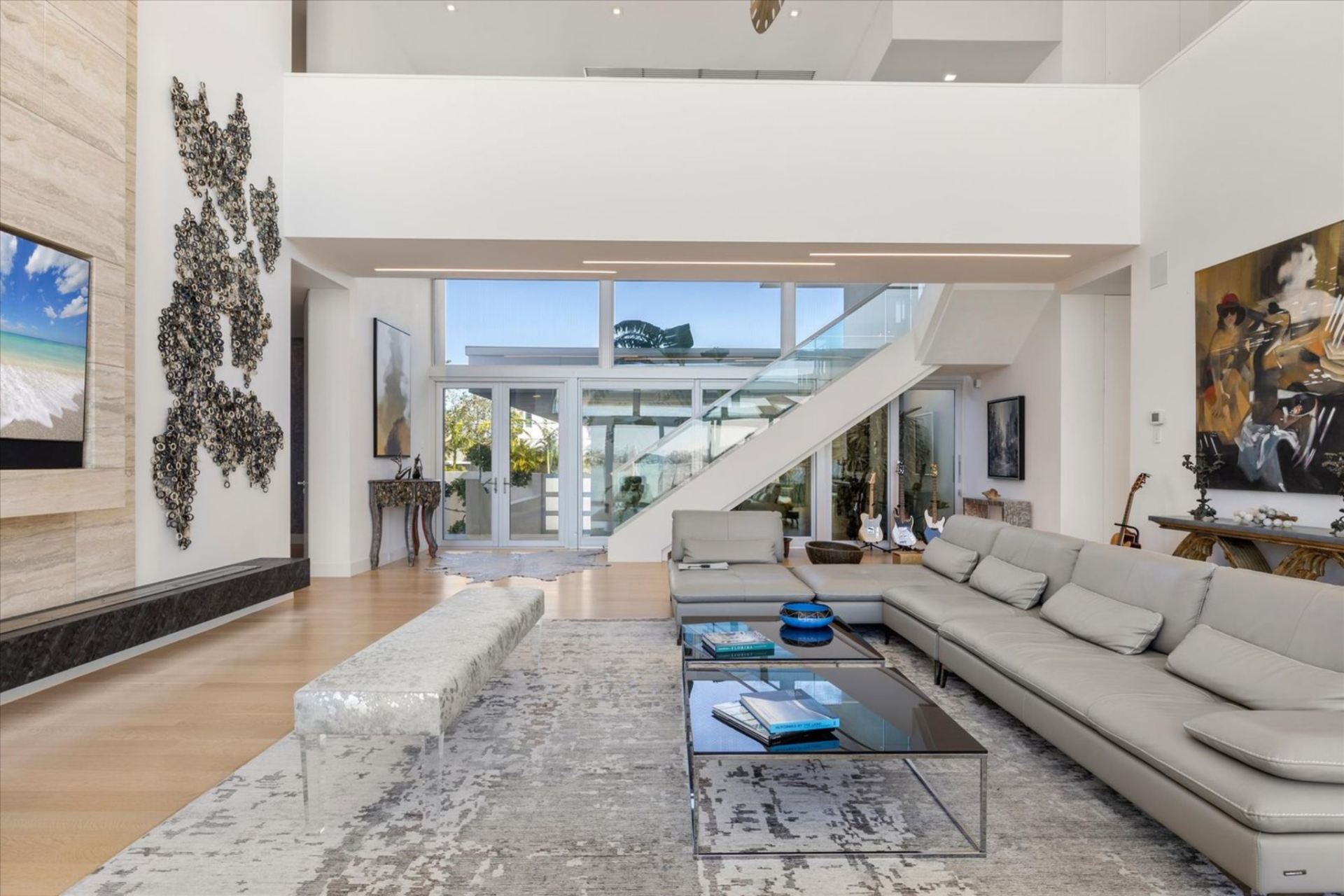 Sculptural lighting and carefully chosen custom finishes introduce warmth and texture, striking a balance between modern precision and livable comfort.