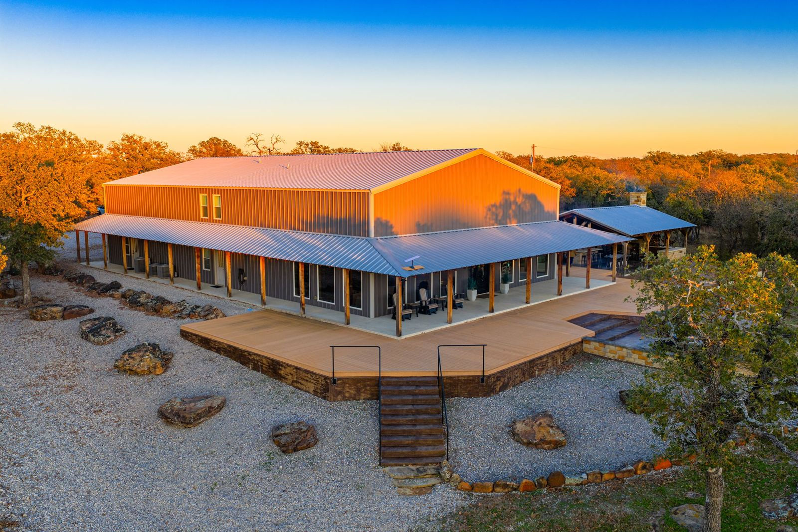 At the center of the ranch sits a 4,225-square-foot main home positioned on a hilltop with sweeping views over a five-acre bass lake. 