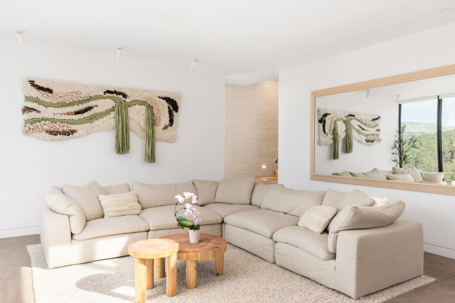 Inside, stone accents and vaulted ceilings ground the room with warmth and texture.