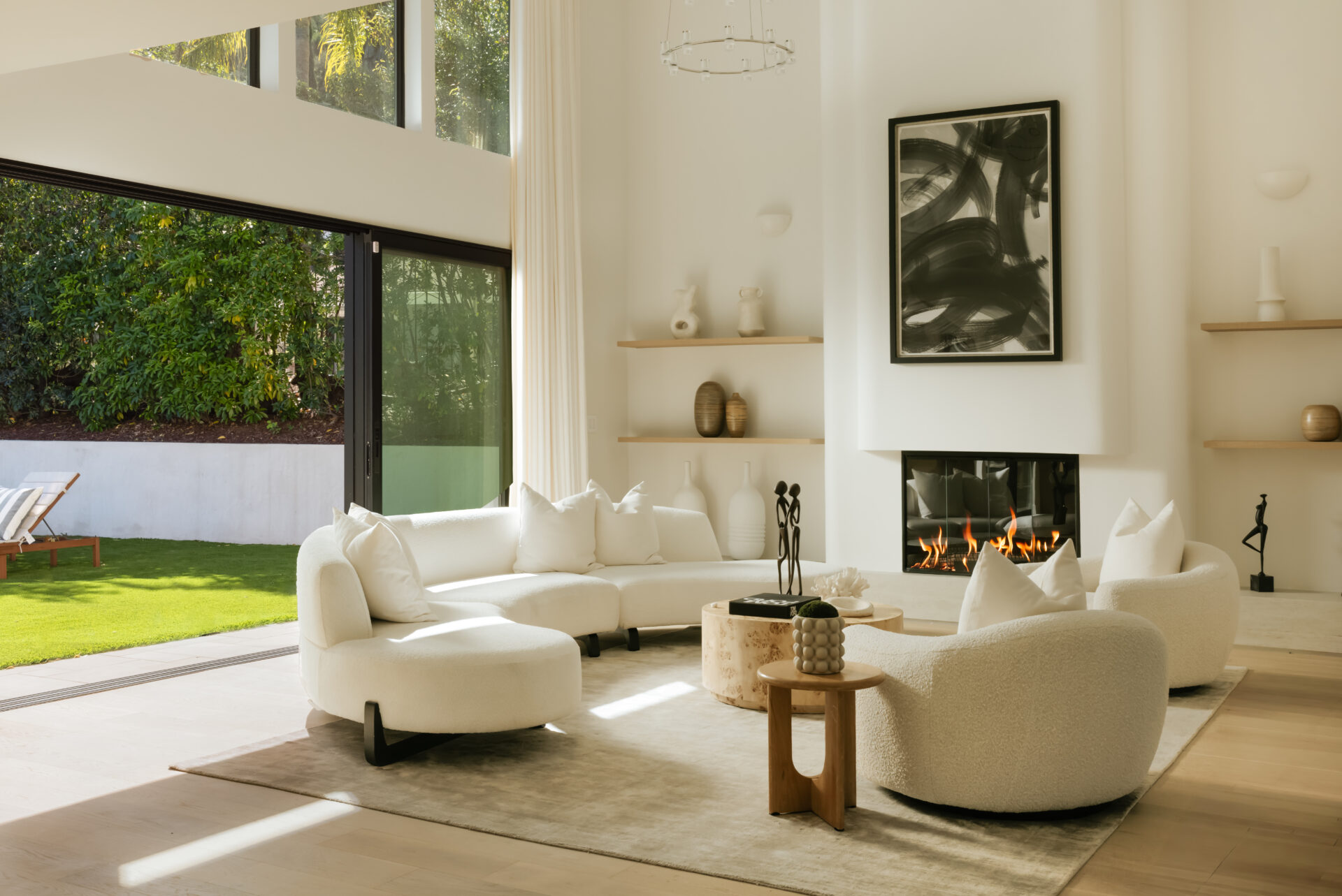 Up a short set of steps, the family room opens into a more relaxed living space defined by its height and connection to the outdoors. 