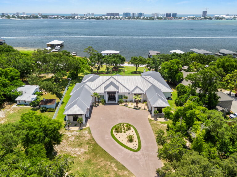 Front exterior of Matt Bryant's former Alabama house in the water.
