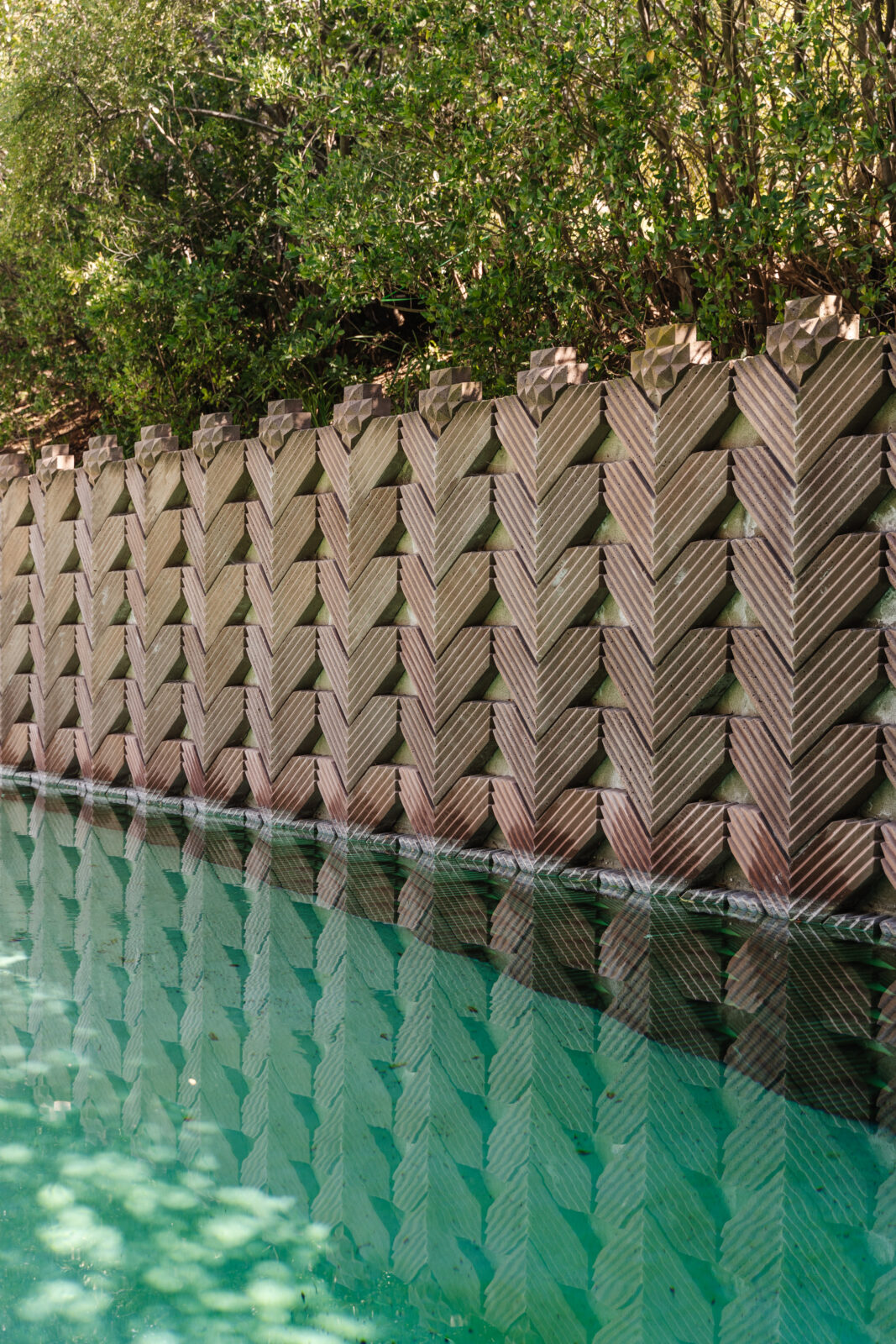 Repeating chevron wall lined the pool.