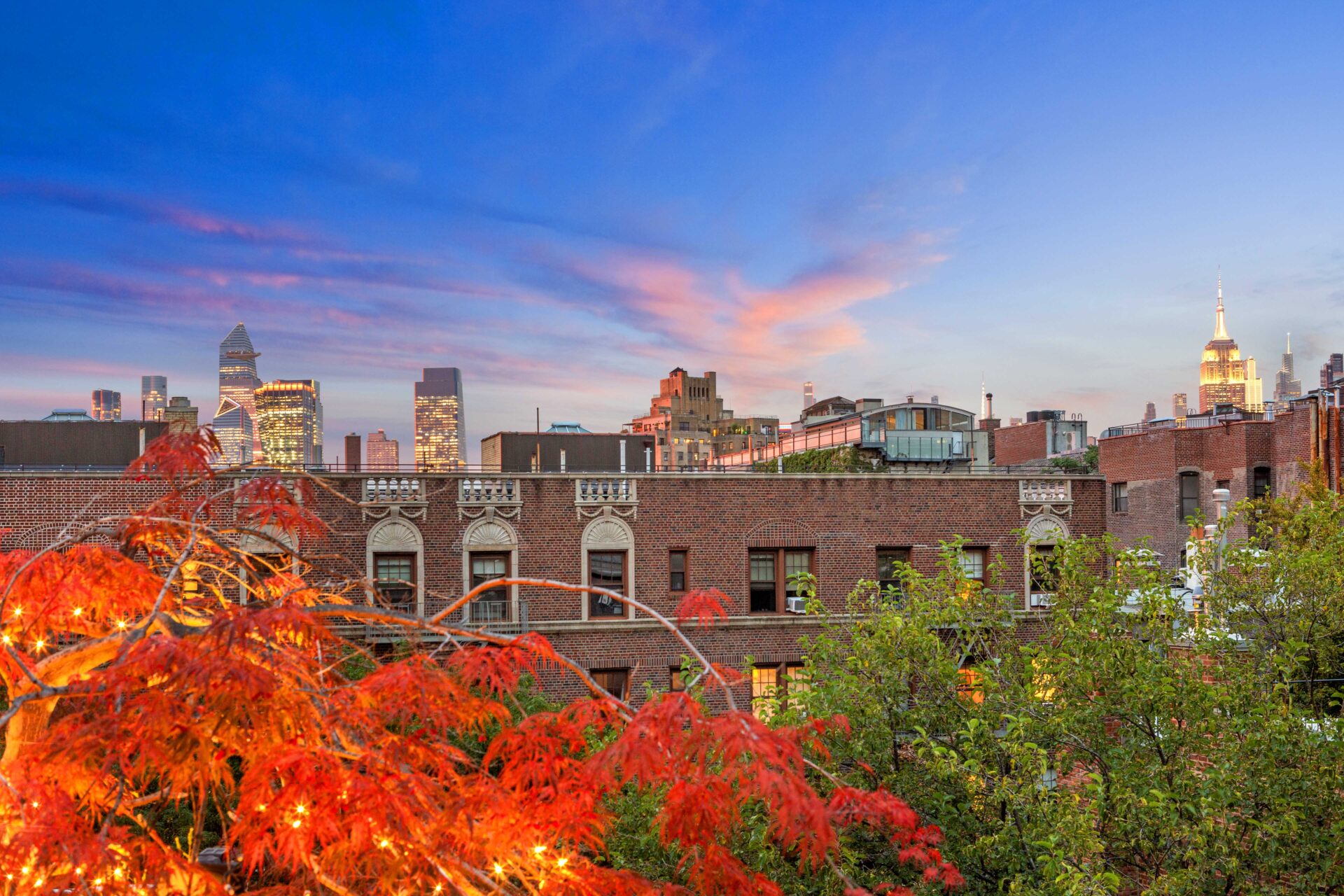 NYC view from the rooftop terrace at dusk.