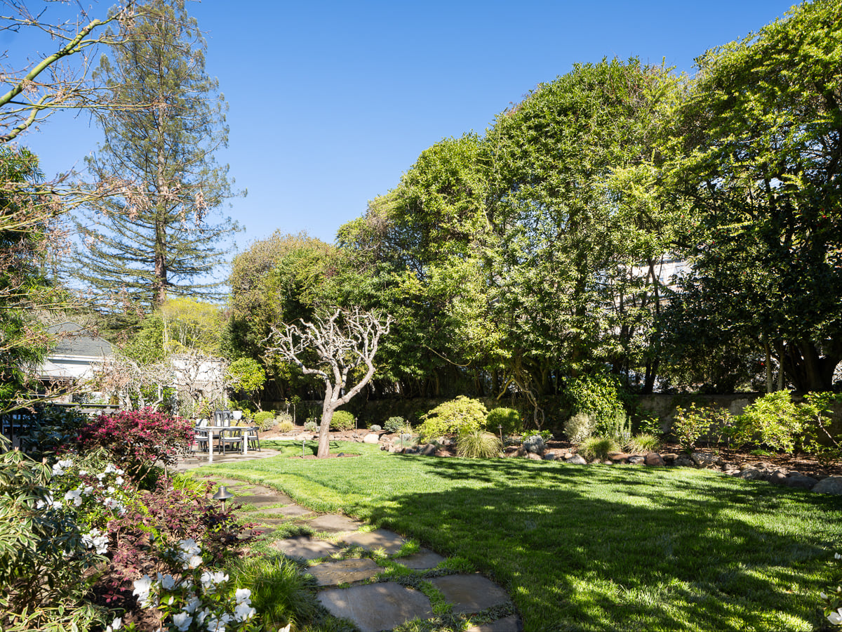 Lastly, connecting every structure are the landscaped grounds, which range from a level lawn, fruit trees, vegetable beds, and a bluestone terrace.