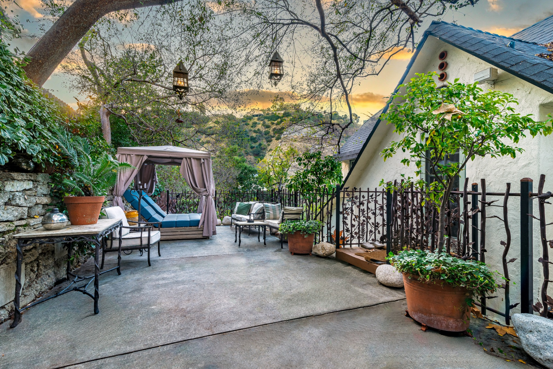 Some of those spaces include a variety of balconies that extend from different levels of the property, offering small vantage points that overlook the greenery and connect the indoor spaces with the landscape.