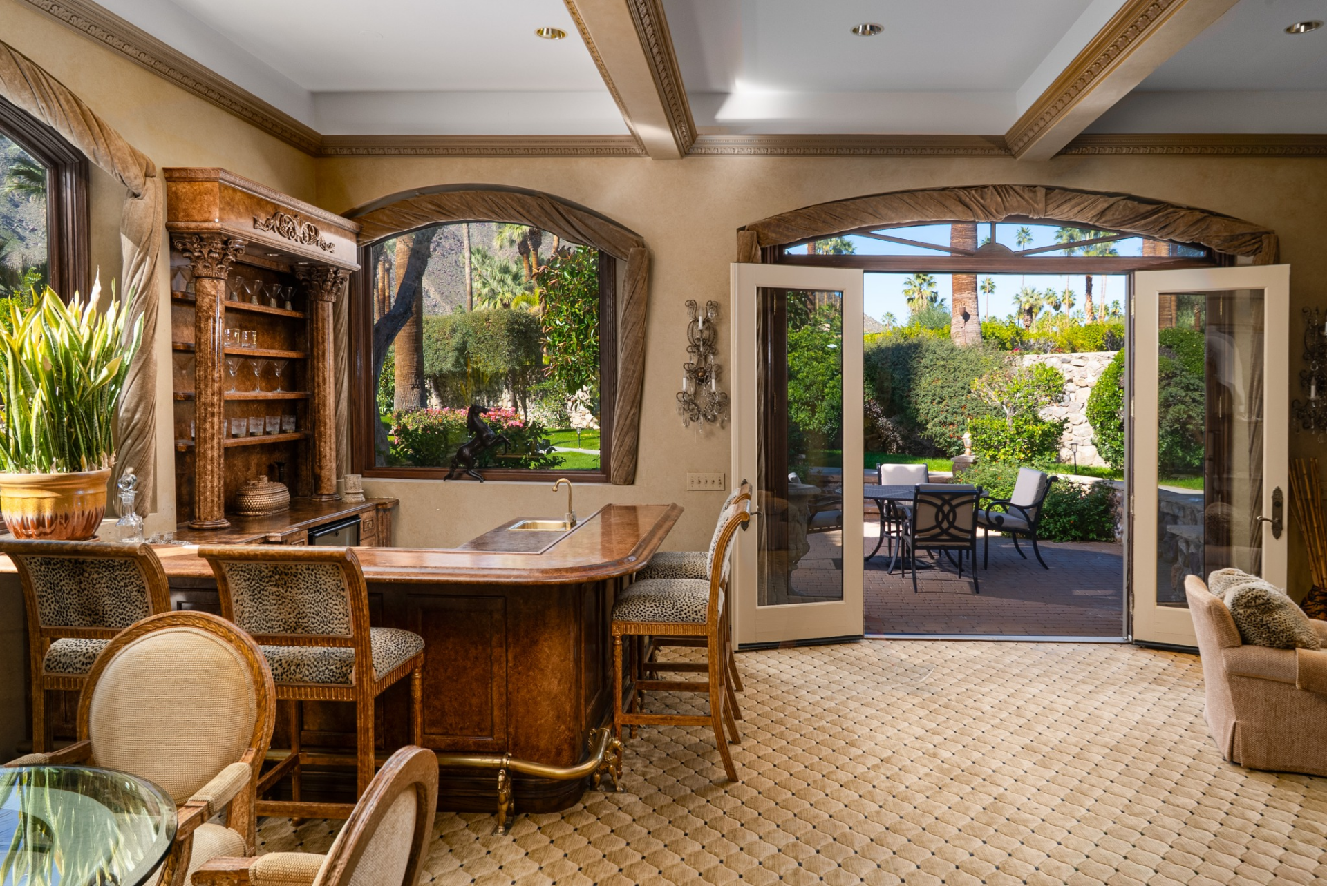 French doors open directly to the outdoor patio.