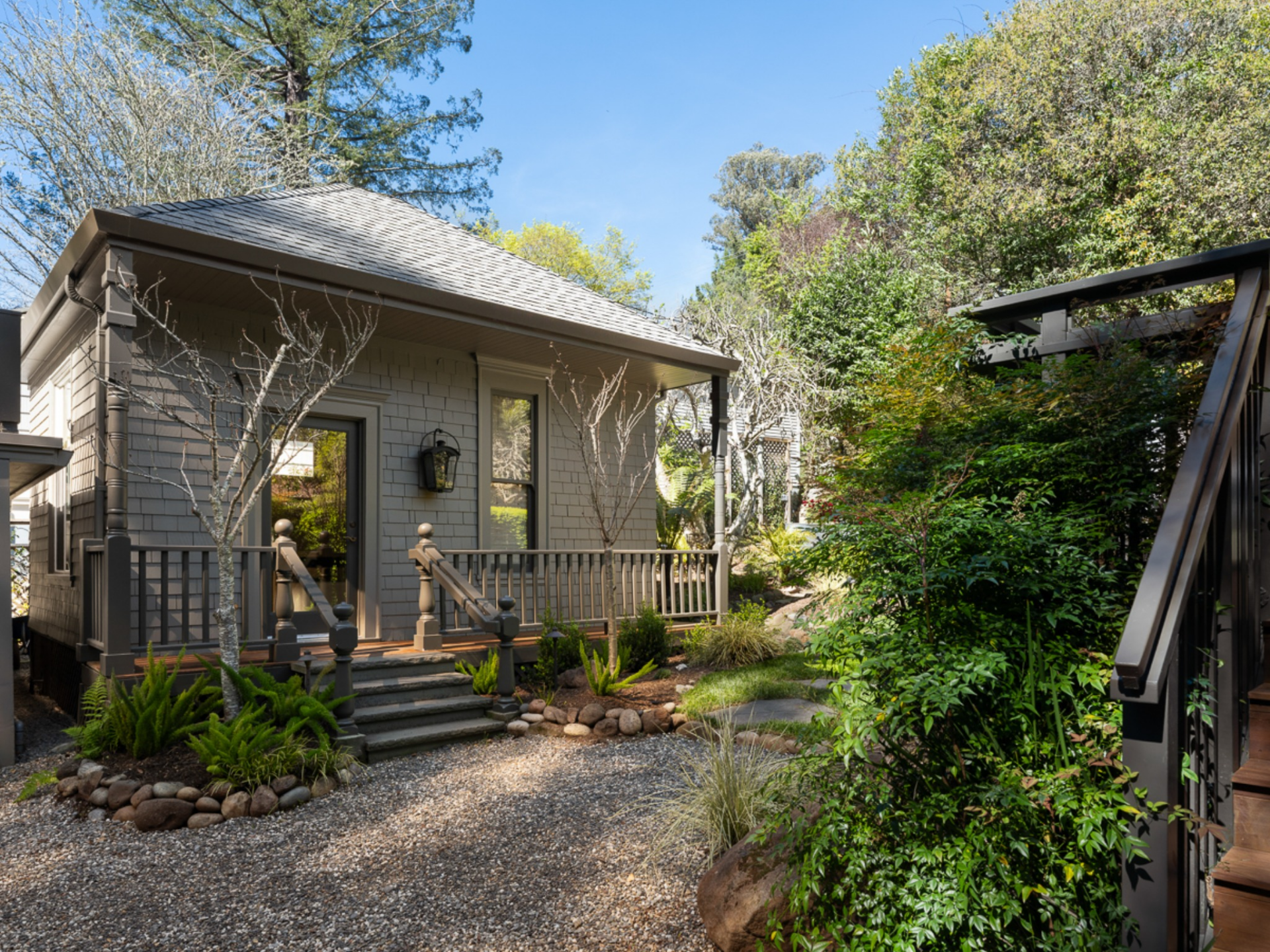 Right next to the Carriage House, a detached cottage introduces a more private, standalone structure tucked into the landscape. 