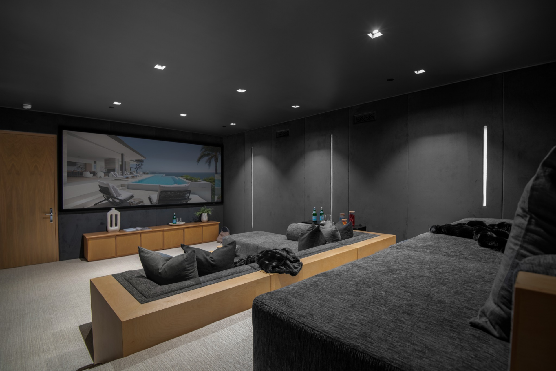 Also in the cellar is a dedicated movie theater designed with a much darker finish than the rest of the house.