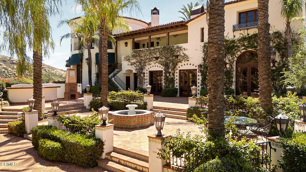 At the center of the property sits a 17,000-square-foot Spanish Colonial-style villa, surrounded by multiple residences, guest accommodations, and event spaces.