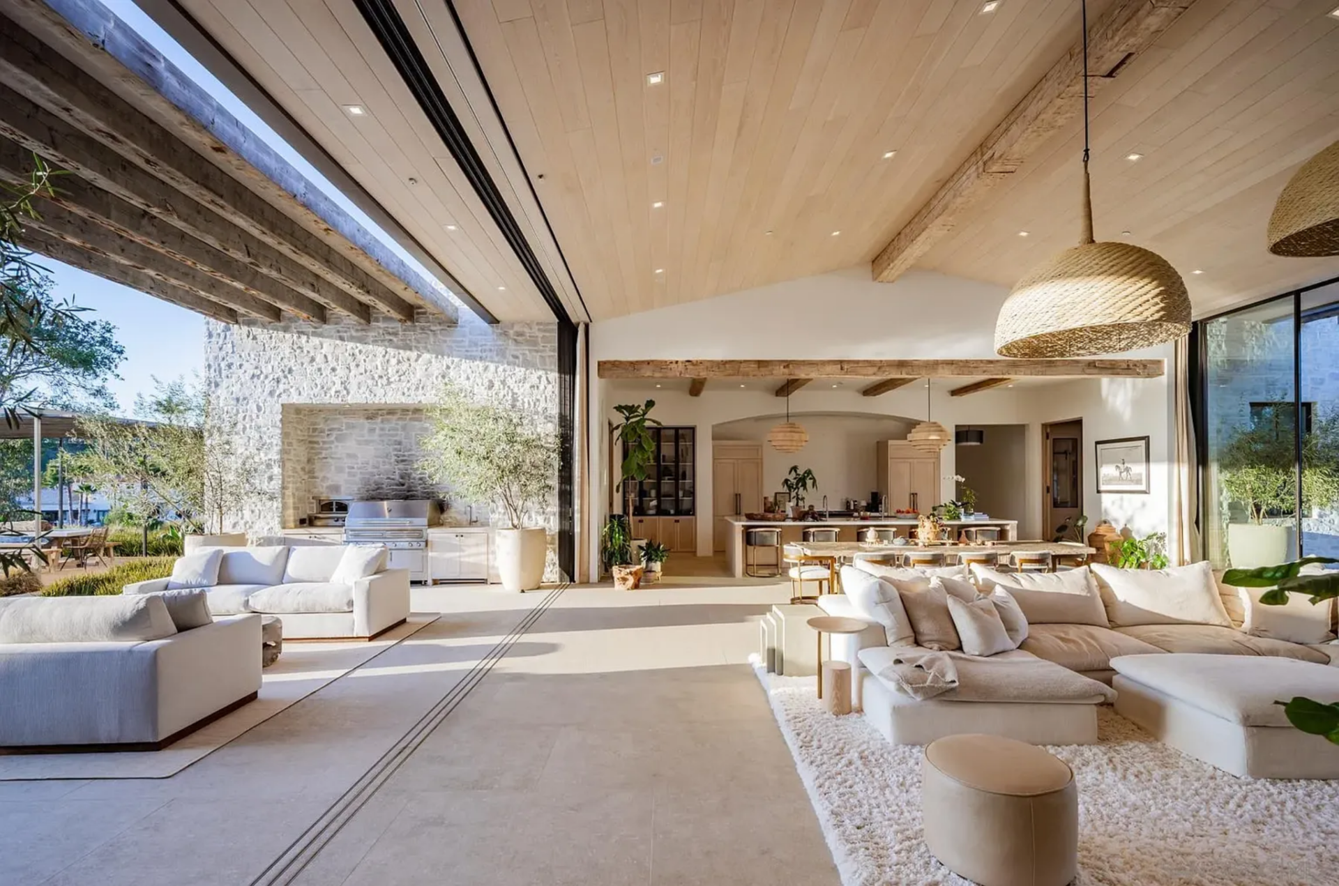 The most unique feature in the room is the wall of 16-foot steel pocket doors, which slide away, extending the living room directly into the covered outdoor lounge.