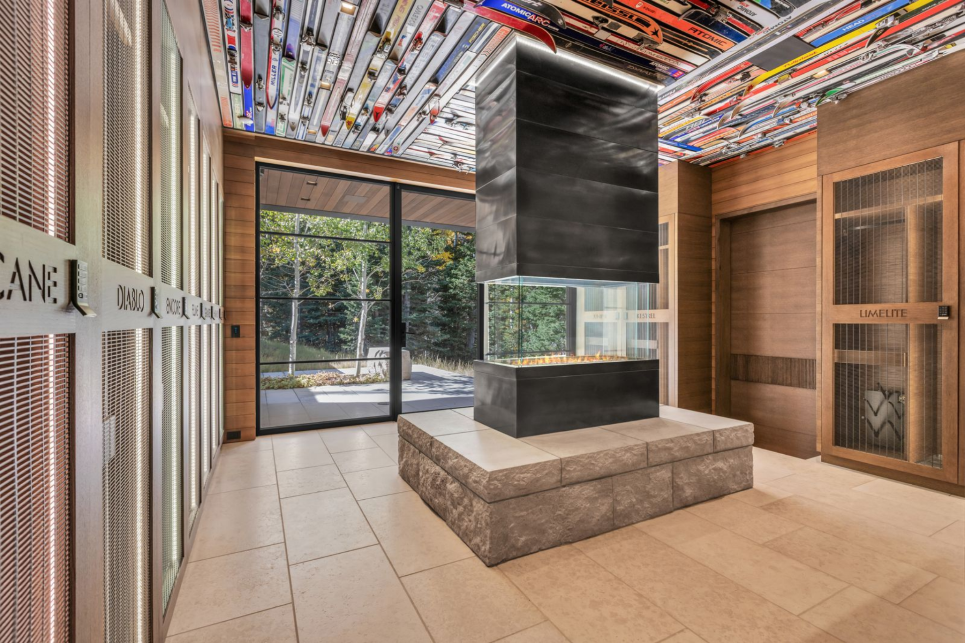 The home also features a ski locker, which has customized lockers for all of your ski equipment centered around a fireplace.