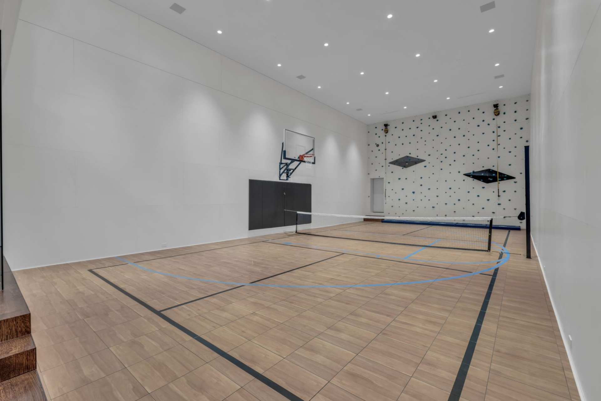The full indoor sports court is set to accommodate games of everything from basketball to pickleball, and even a climbing wall that rises along the back.