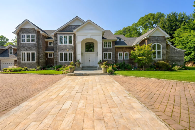 Bravo's "Summer House" mansion opens up at the end of a long brick driveway.