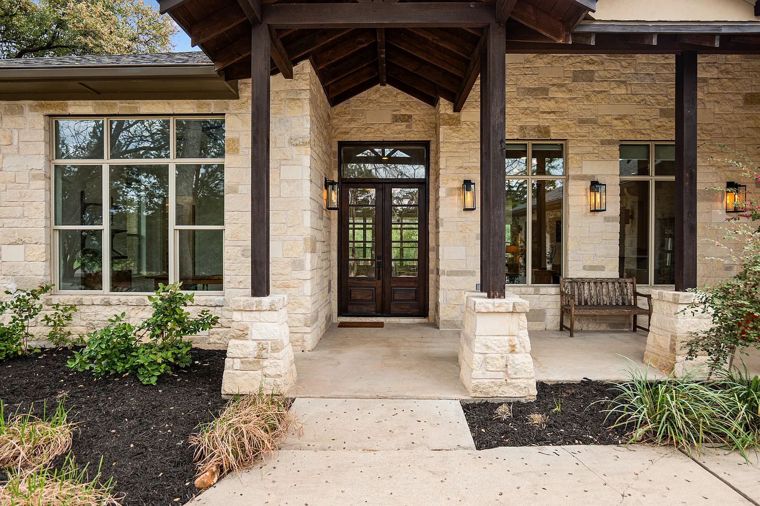 A covered front porch leading into Tate Donovan's home.