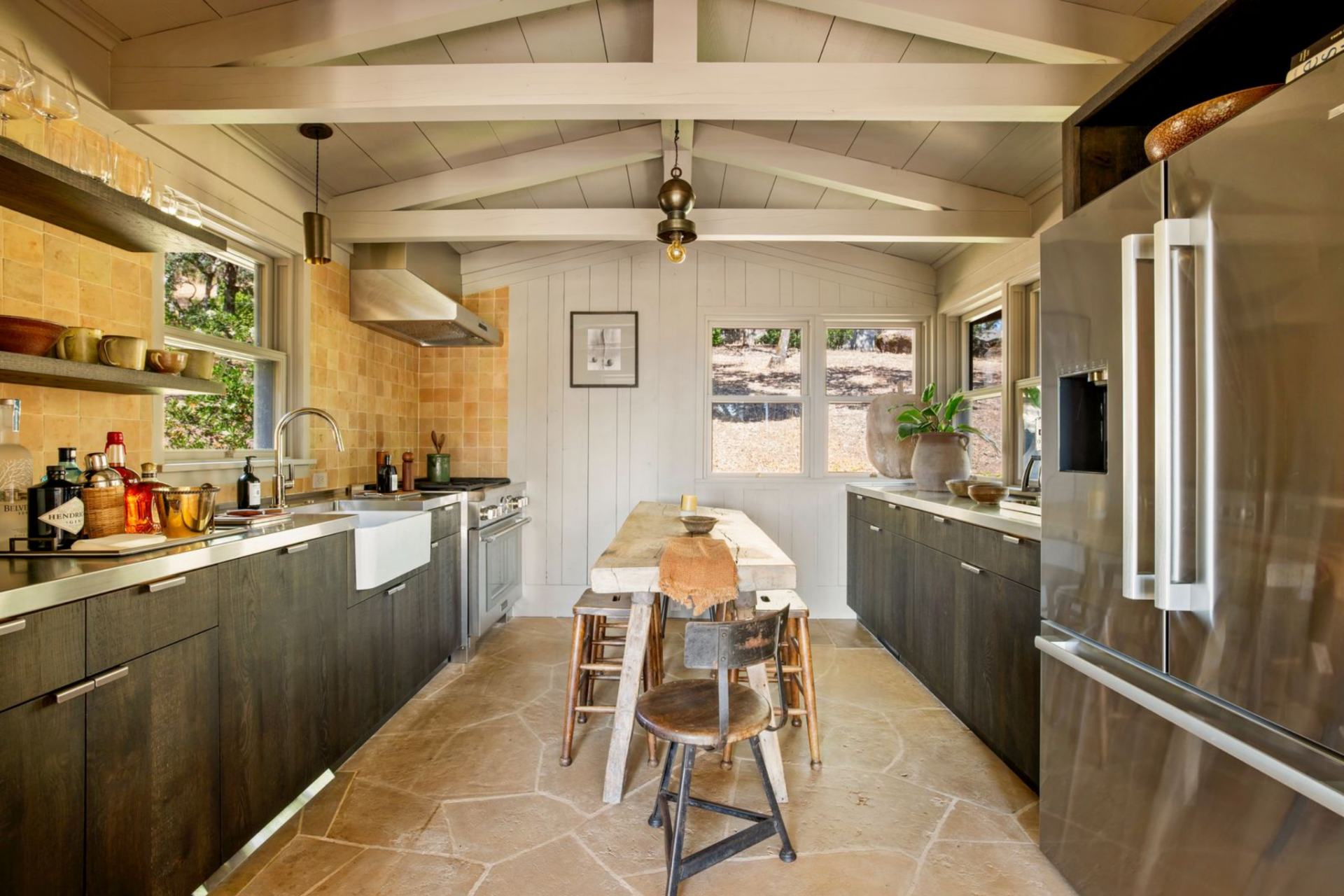 The kitchen is set just off the living space, arranged in a galley layout with cabinetry and appliances running along both sides. 