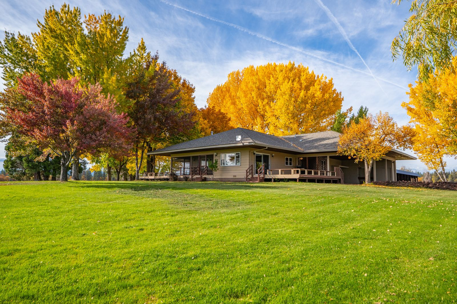 The main residence is positioned along Spring Creek, designed as a three-bedroom cabin with direct views of the water. 