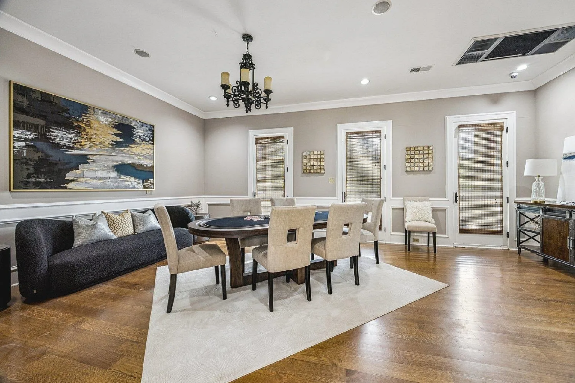 Designed for intimate gatherings, the poker room centers around a custom game table surrounded by upholstered chairs.