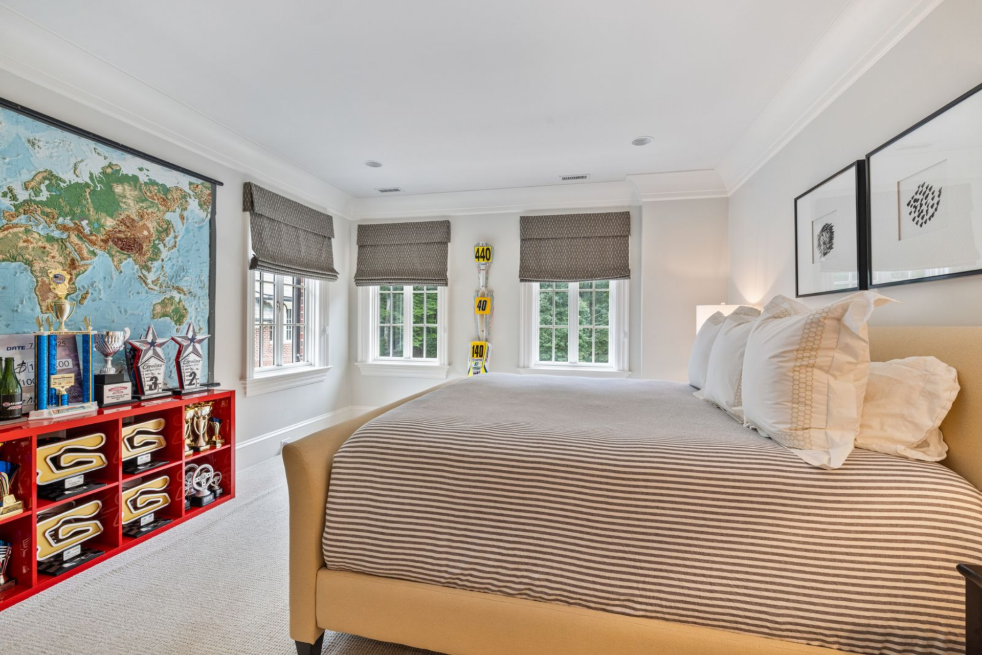 His son’s room shows off his desire to follow in his father's footsteps, with one wall dedicated to trophies, awards, and memorabilia that show off the pursuit of a racing career.