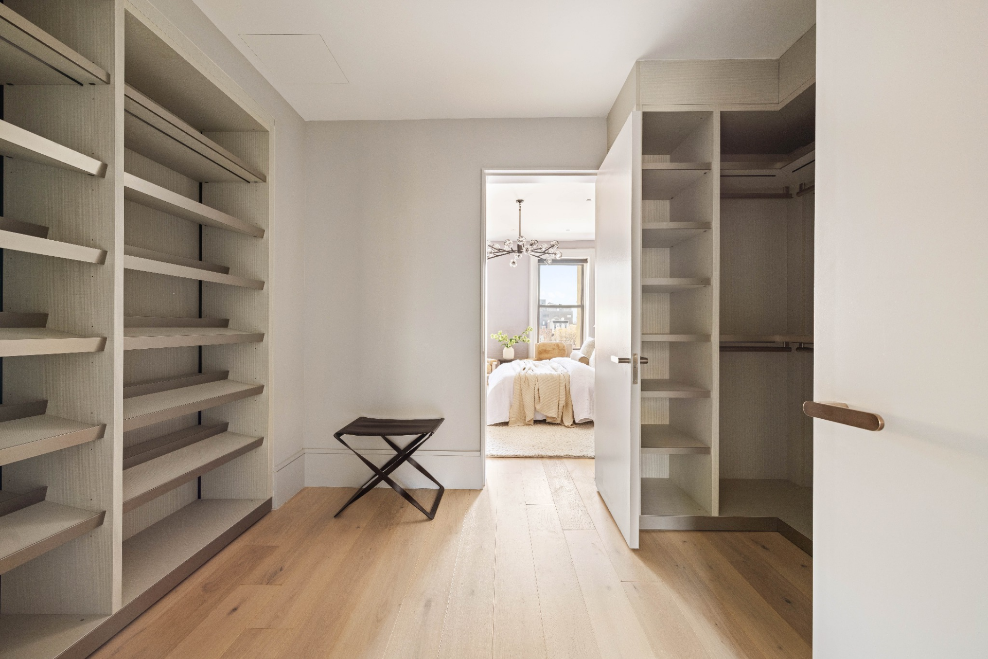 One side is fitted with angled shelving suited for shoes or display storage, while the other incorporates hanging rods and vertical compartments for clothing.