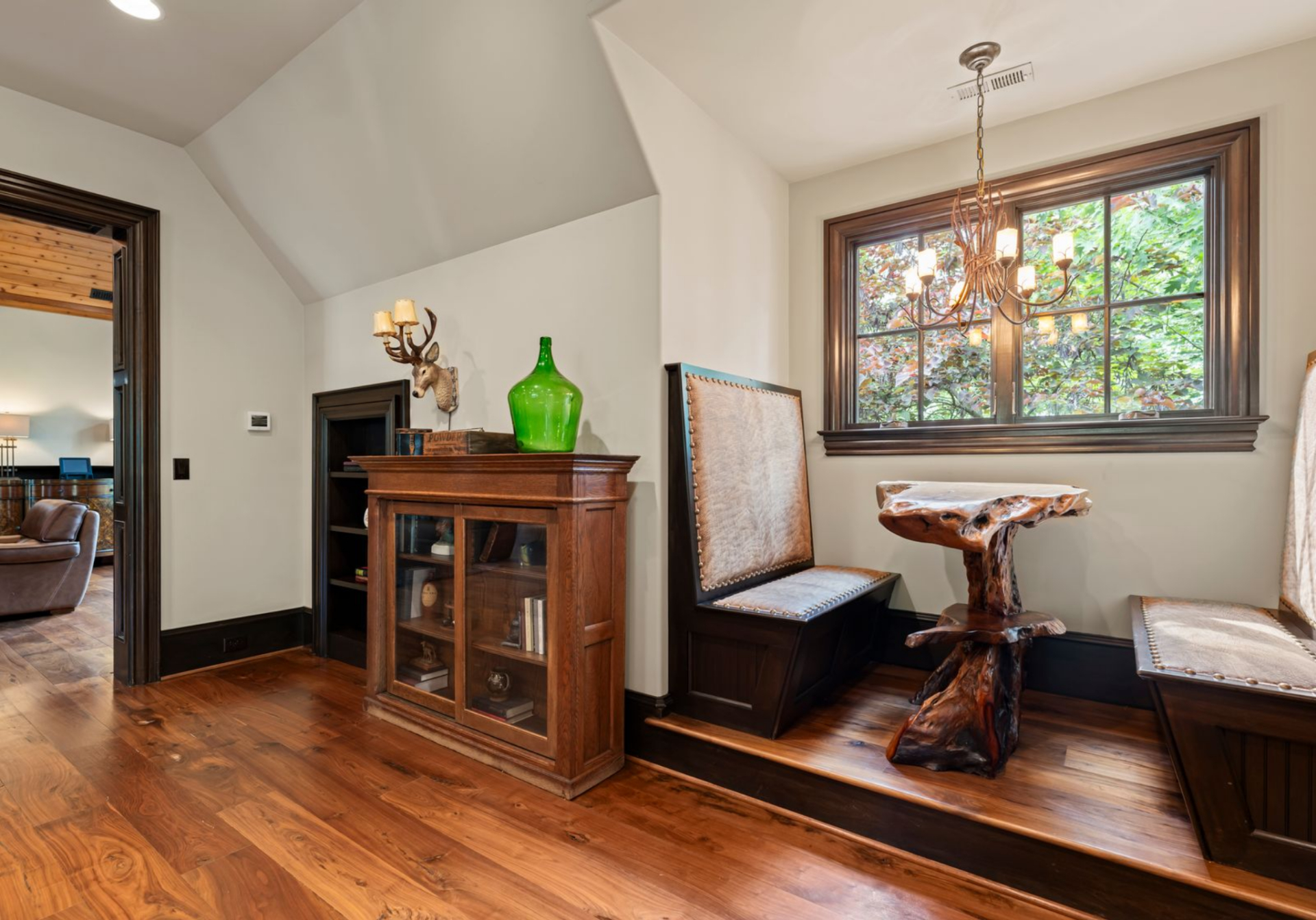 The space includes stainless-steel appliances, a small sink area, bar seating, and a small breakfast nook, giving guests a functional place for casual meals.