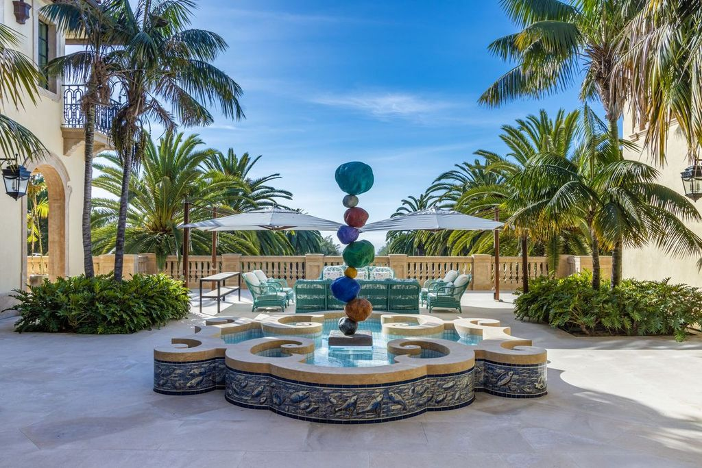 The inner courtyard featuring a fountain and shaded lounge.