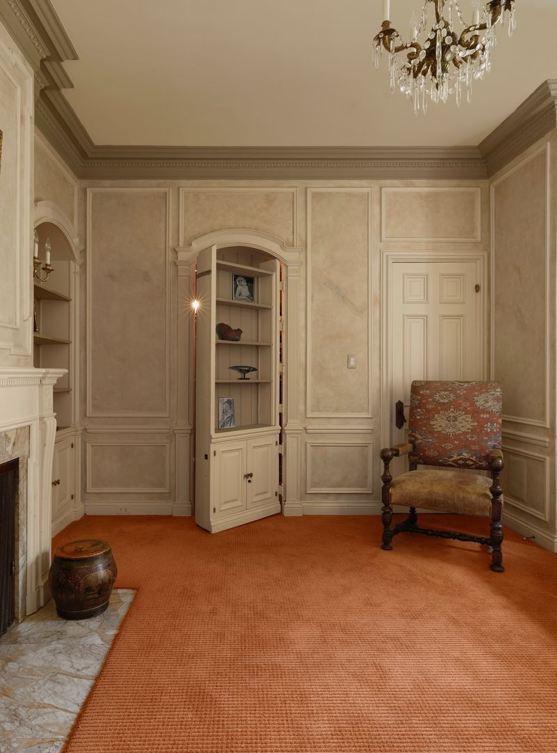 What makes the space even more unusual is the concealed Prohibition-era bar tucked behind one of the built-in bookcases.