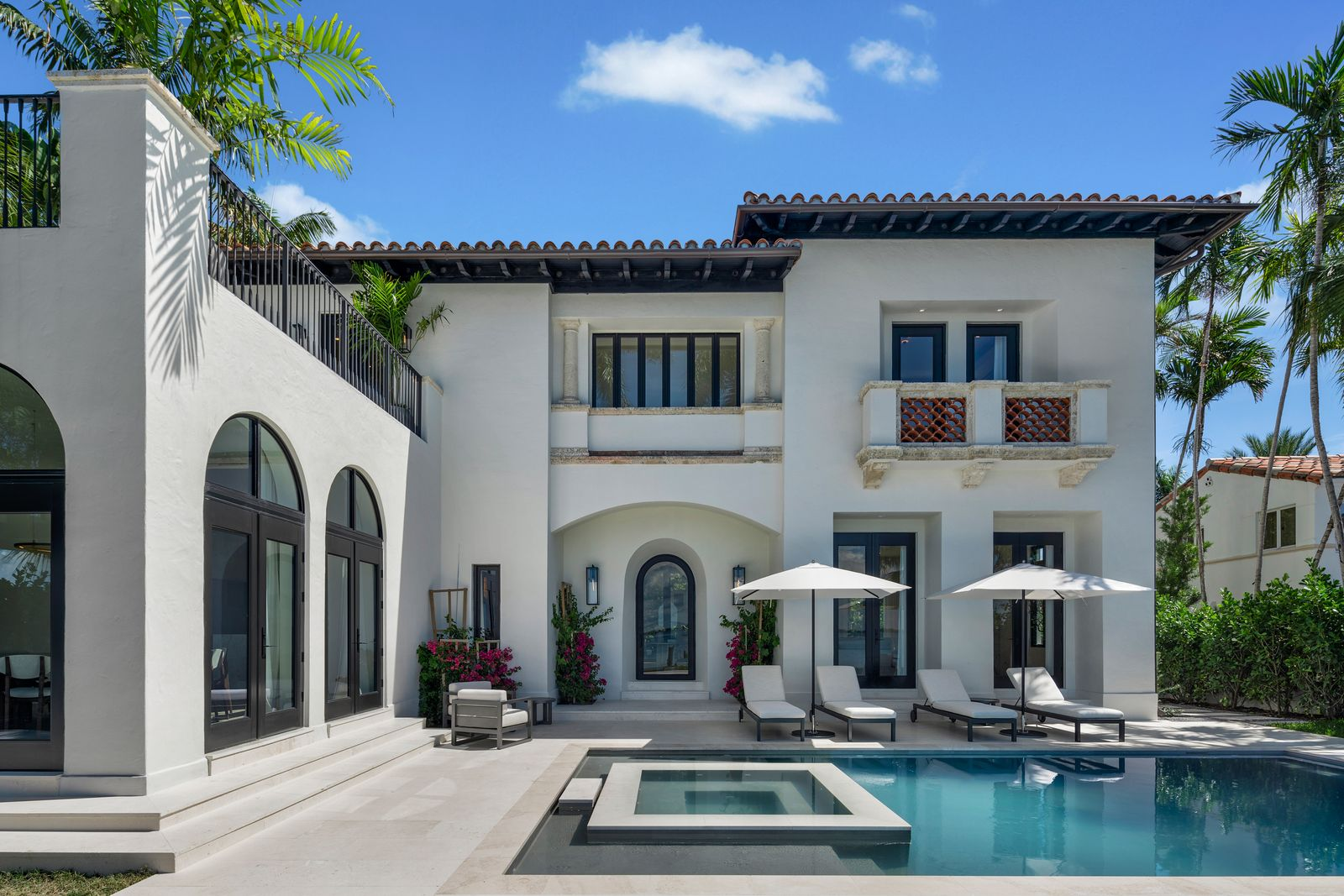 Outside, the waterfront terrace extends directly from the home with a newly built pool and raised jacuzzi positioned toward unobstructed bay views. 
