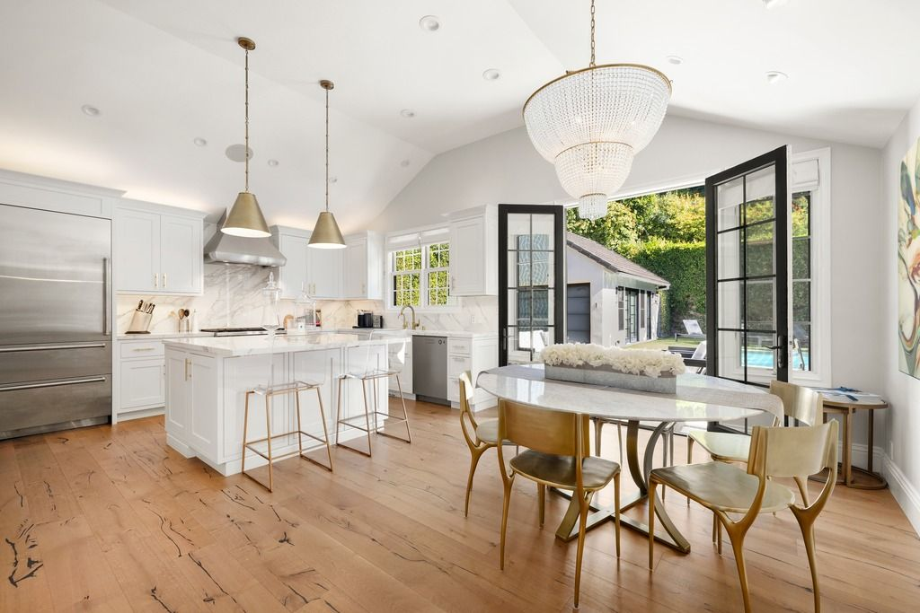 Wolf and Sub-Zero appliances are integrated into the design alongside updated cabinetry and modern fixtures, allowing the kitchen to feel polished without becoming overly formal.