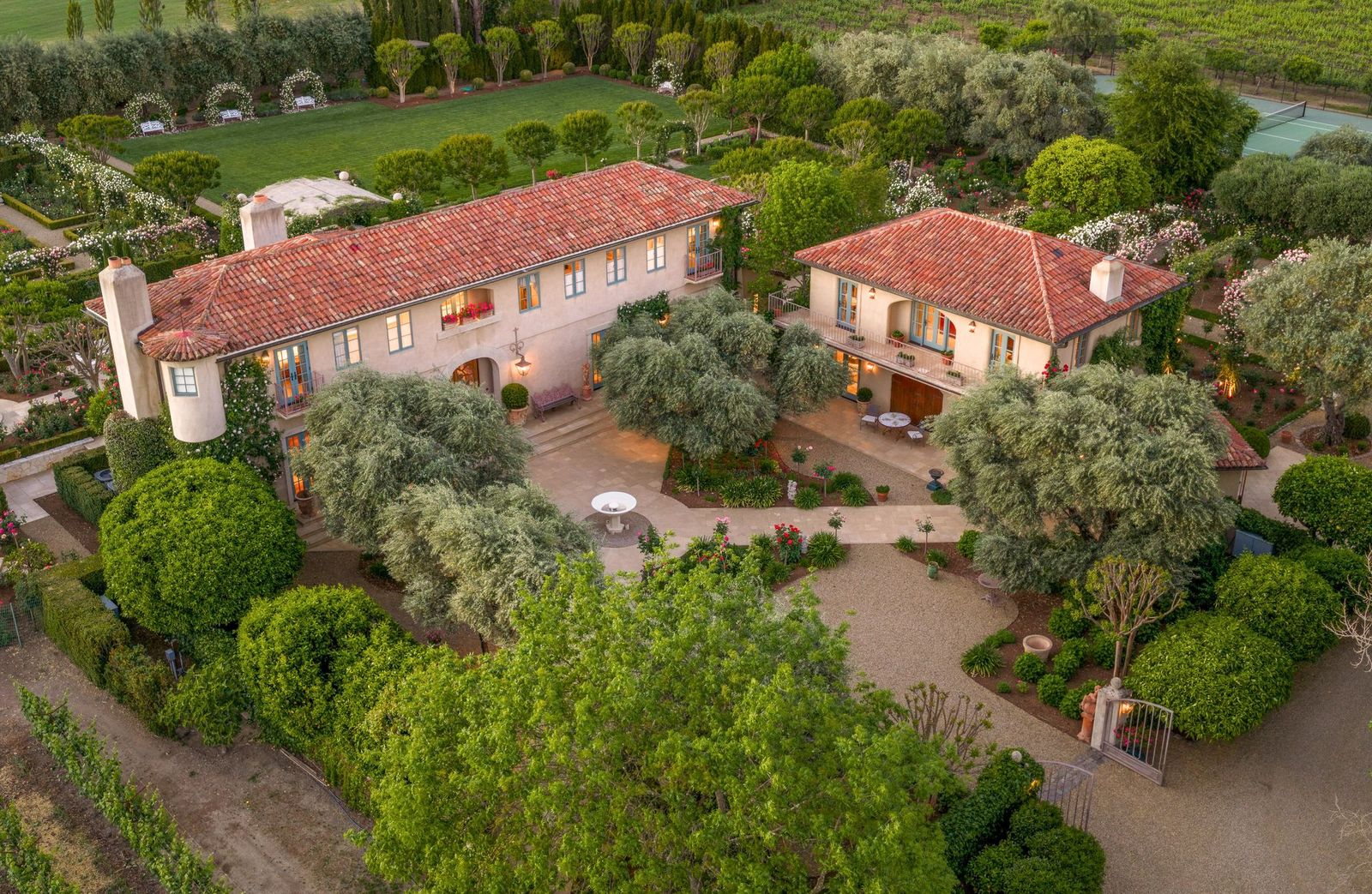 The main residence, where the estate originally started, is organized around large indoor-outdoor gathering spaces that connect directly to the surrounding grounds.