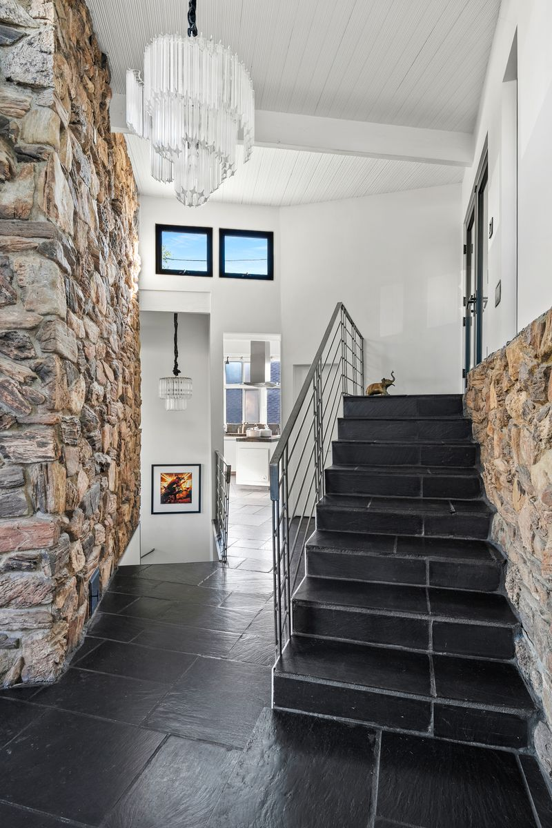 Stepping inside Ava Gardner’s former Hollywood home, the mid-century character of the residence immediately comes into focus through its layered materials and preserved architectural lines. 
