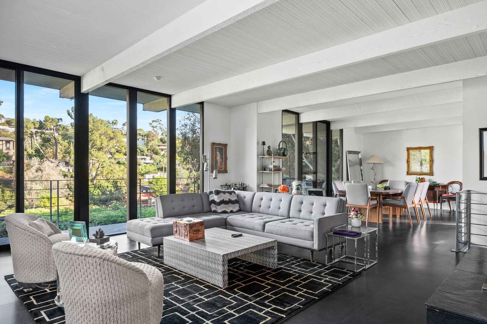 The open layout connects the living and dining areas into one continuous gathering space, allowing natural light to move across the room throughout the day.