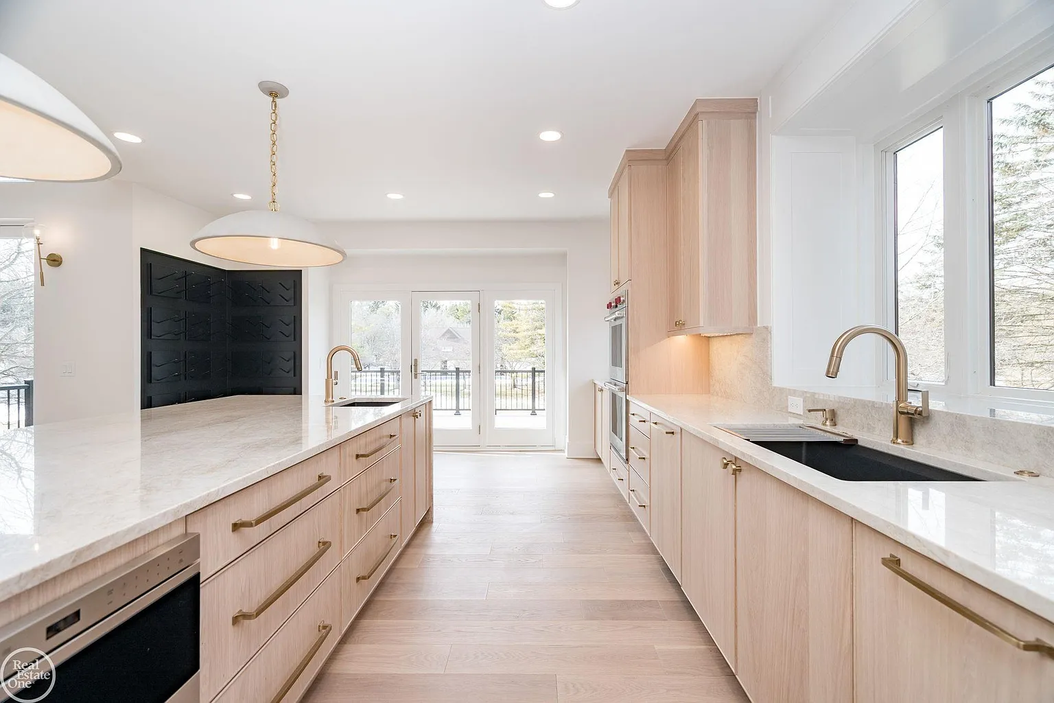 A secondary prep sink, generous counter space, and direct access to the outdoor deck.