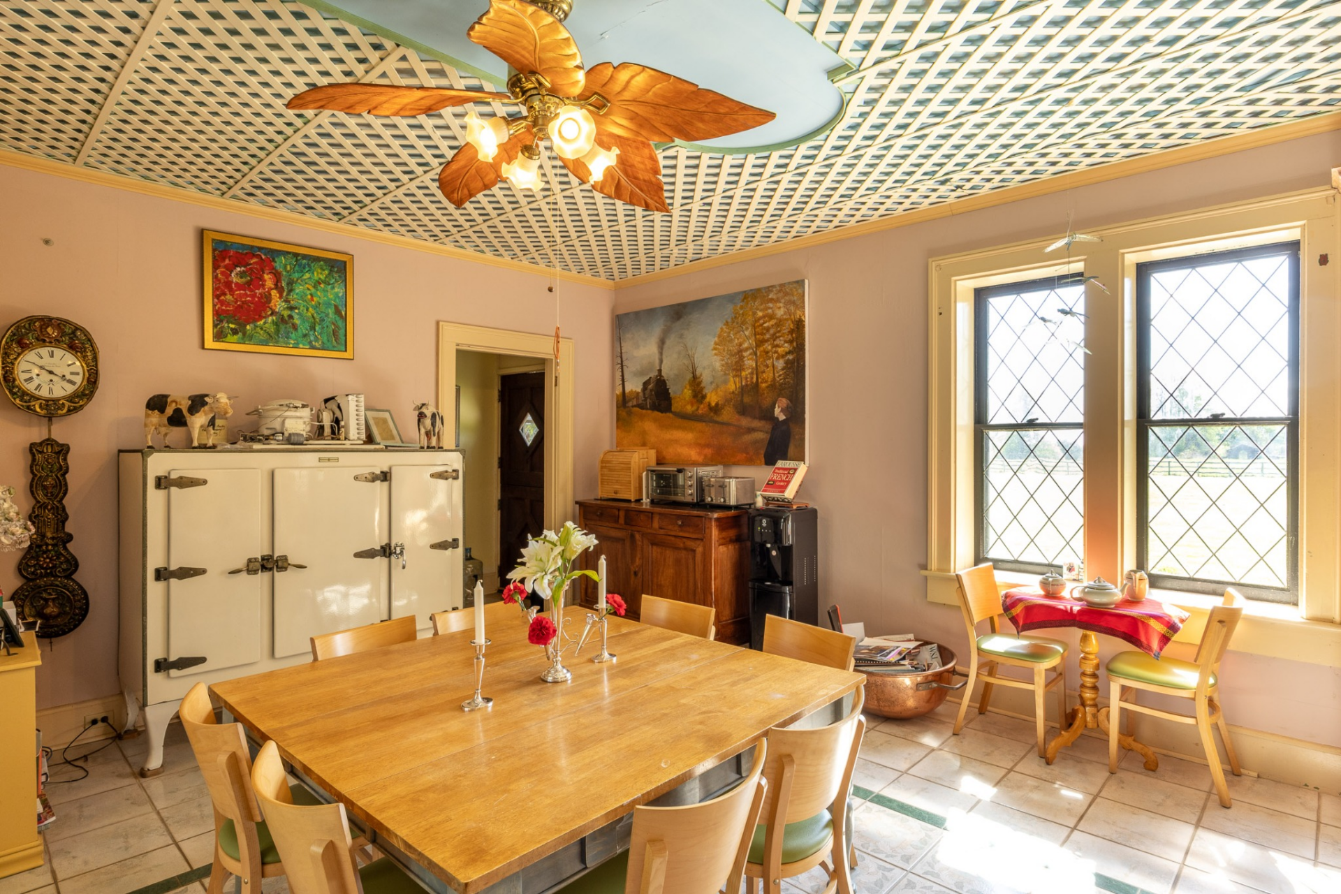 Closer to the kitchen, a smaller breakfast room provides a more intimate setting for everyday meals. 