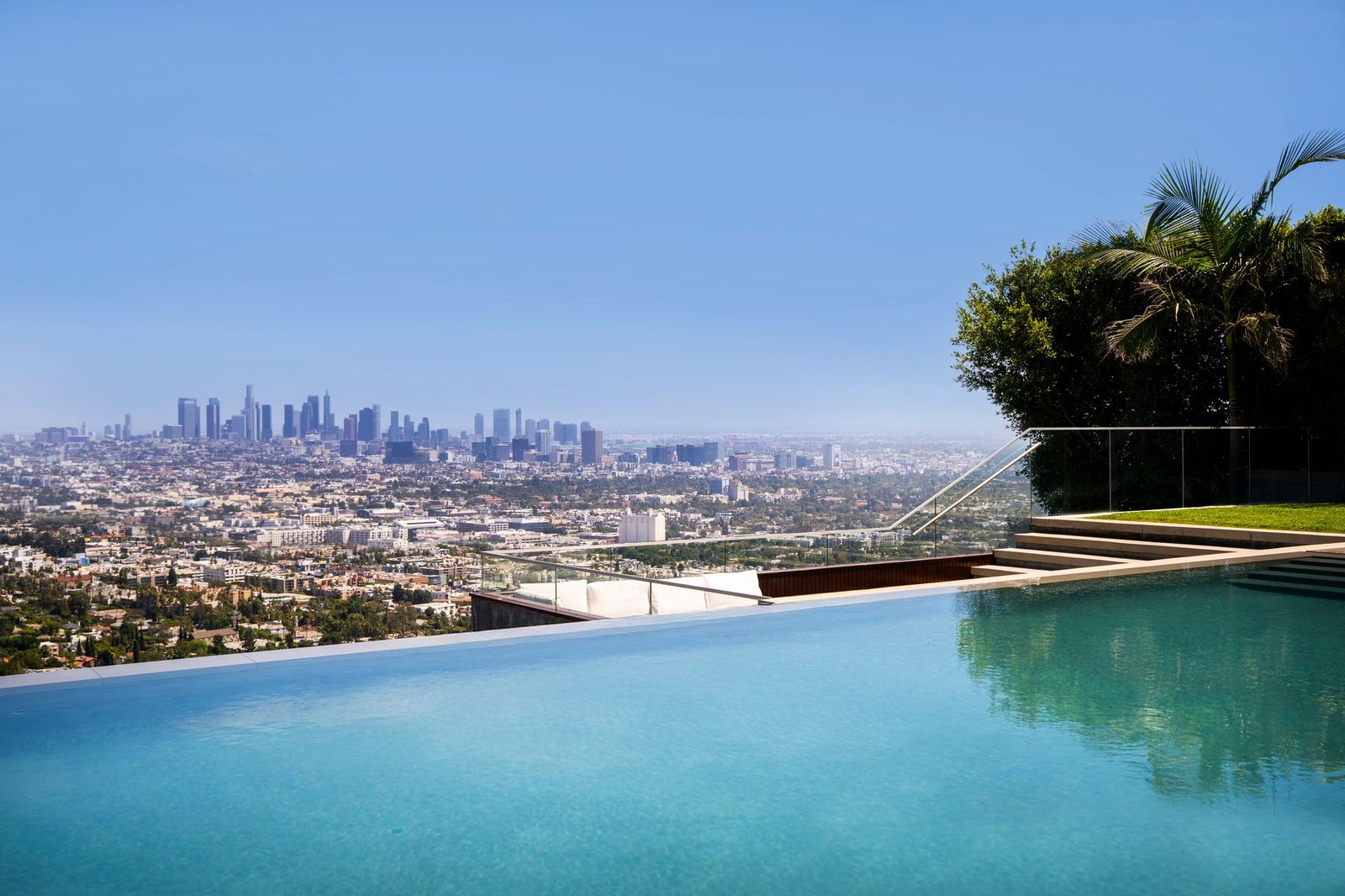 View of downtown LA beyond an infinity edge pool.