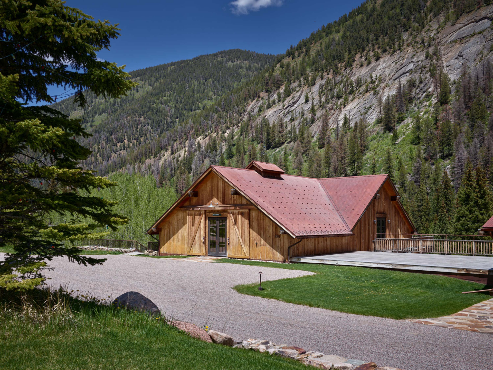 A fitness center cabin at the bottom of a mountainside.