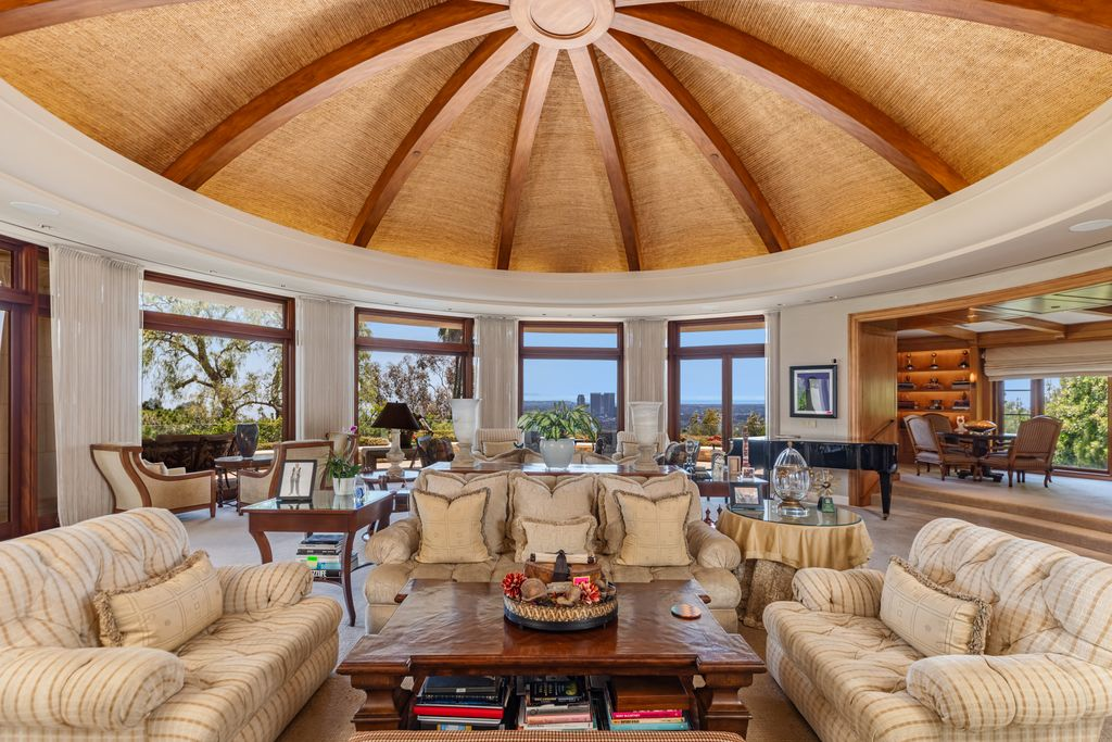 The room is crowned by a domed ceiling finished with woven natural materials and radiating wood beams.