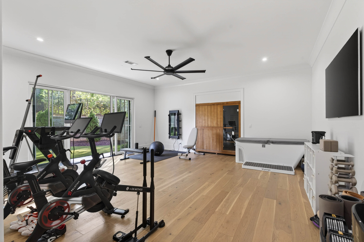 The entertainment wing concludes with a fitness studio complete with cardio equipment, training space, and recovery amenities.