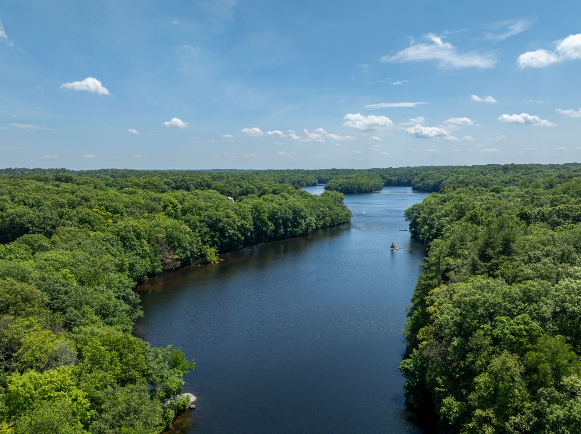 Completing the property, the estate's acreage extends to more than 100 feet of frontage along Converse Lake.