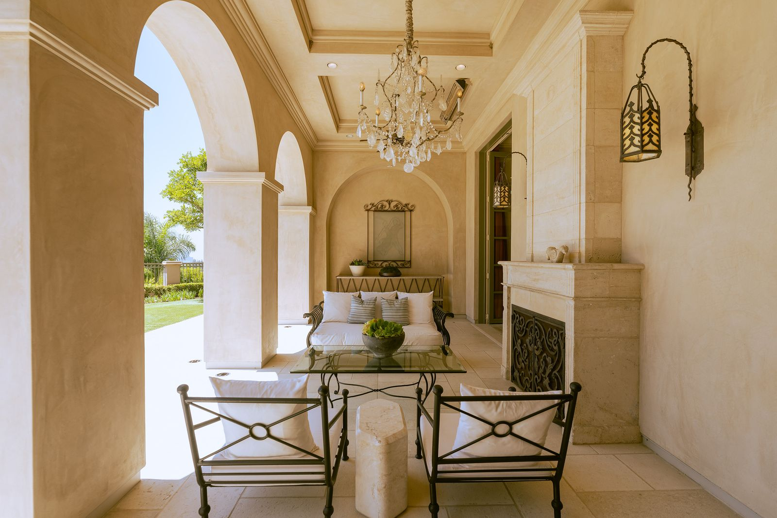 A covered loggia serves as an outdoor living room.