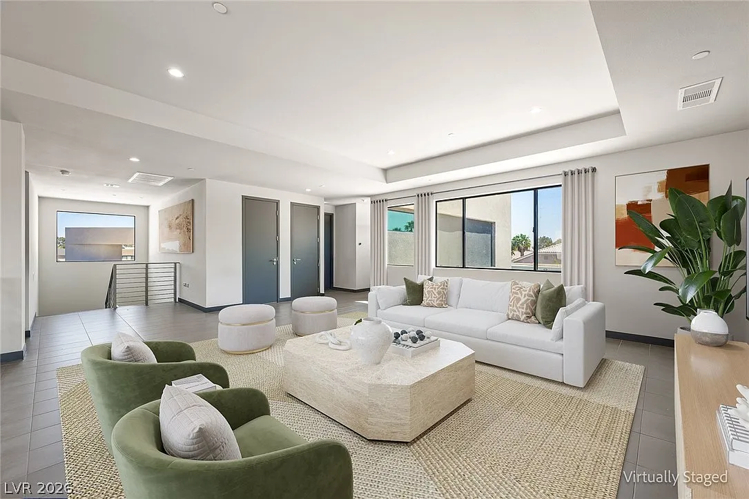 Within the loft, there's plenty of room for multiple seating arrangements, with wide walkways leading off to the surrounding bedrooms.