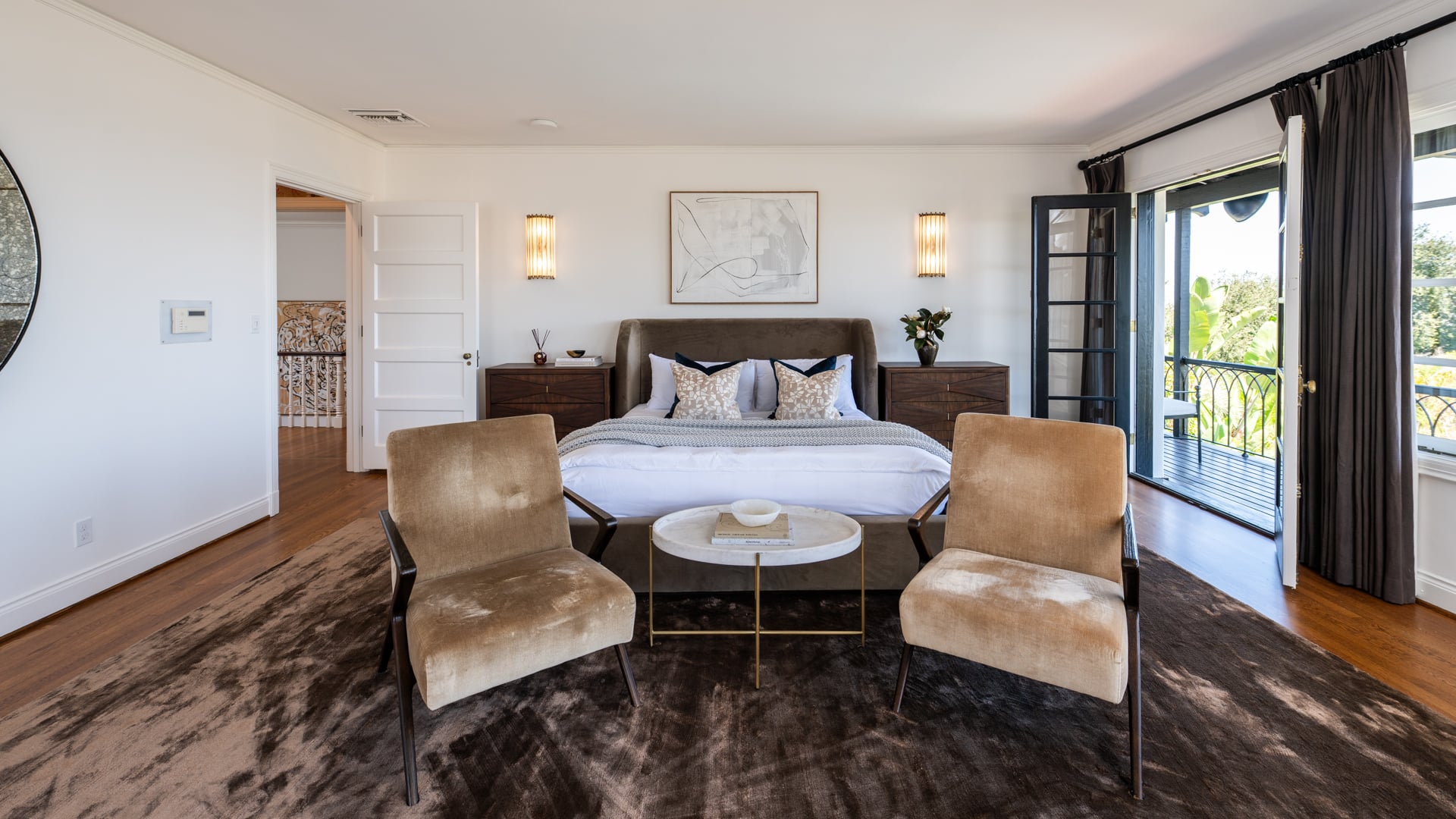 On the other side of the room and next to the bed, French doors open directly onto a private balcony.
