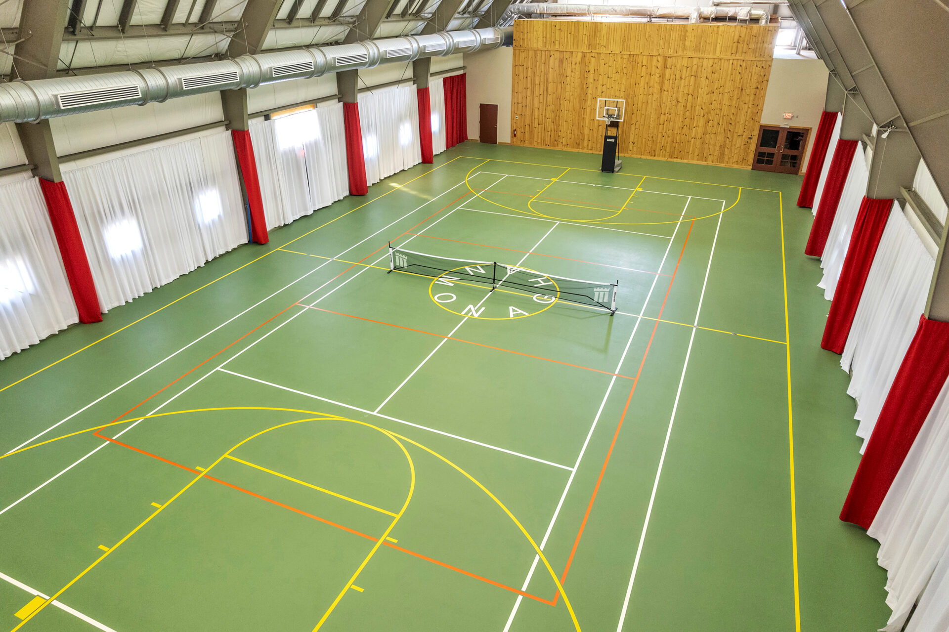 Additional sporting options within the building come from a multi-use court configured for basketball, pickleball, and indoor tennis.