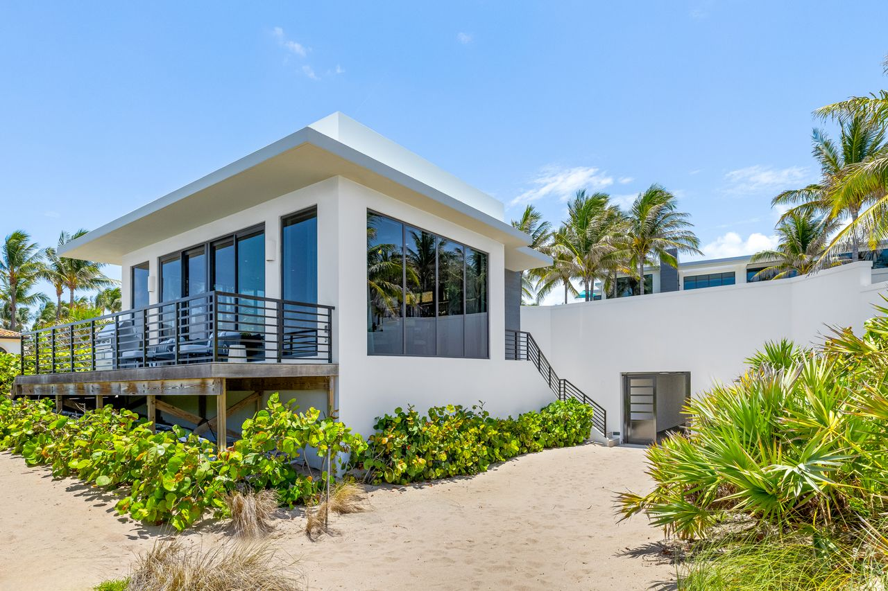 Beachfront cabana with outdoor grilling terrace.