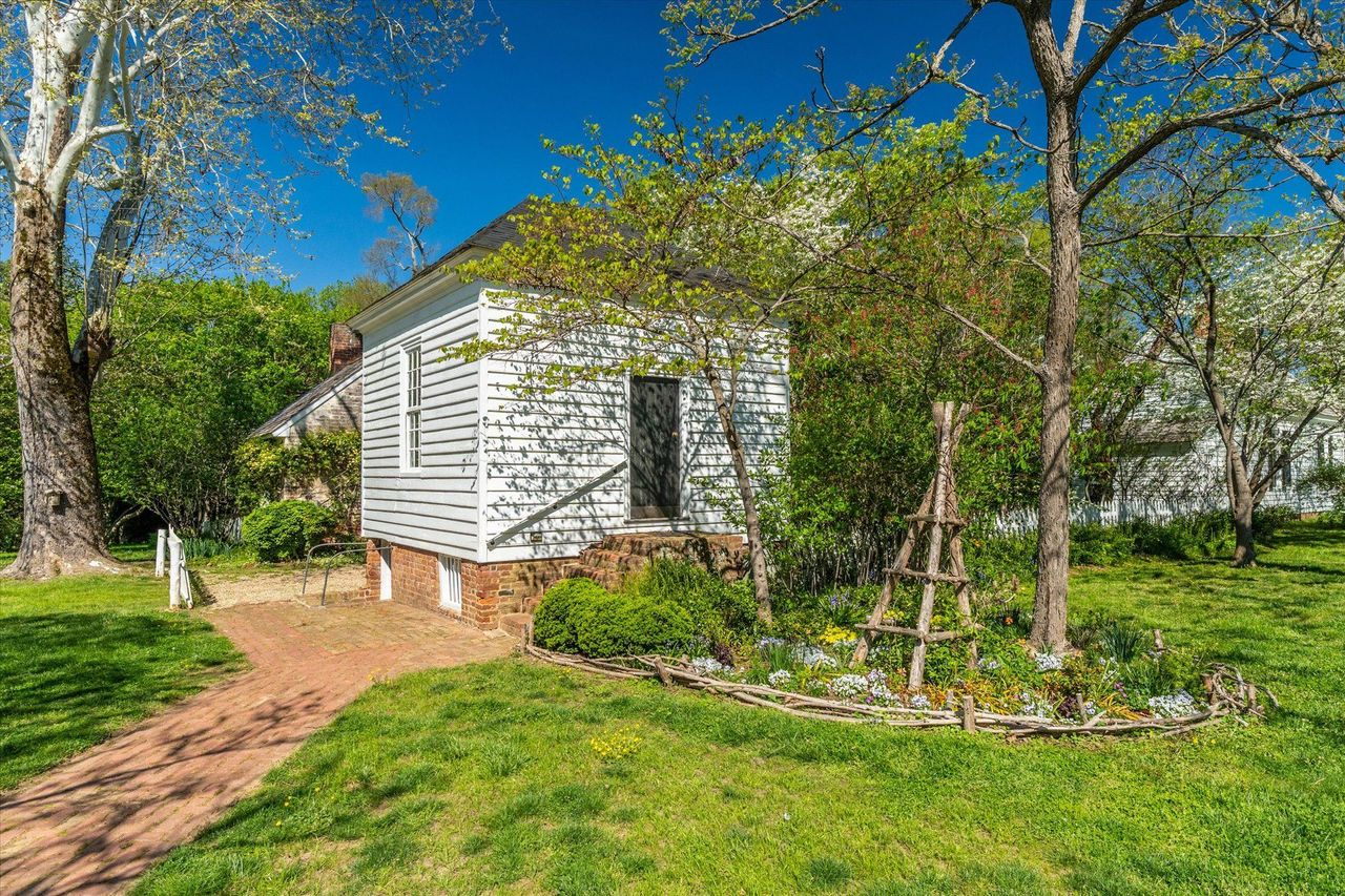 Following the brick paths away from the manor, one of the original plantation buildings has been adapted into a double office.
