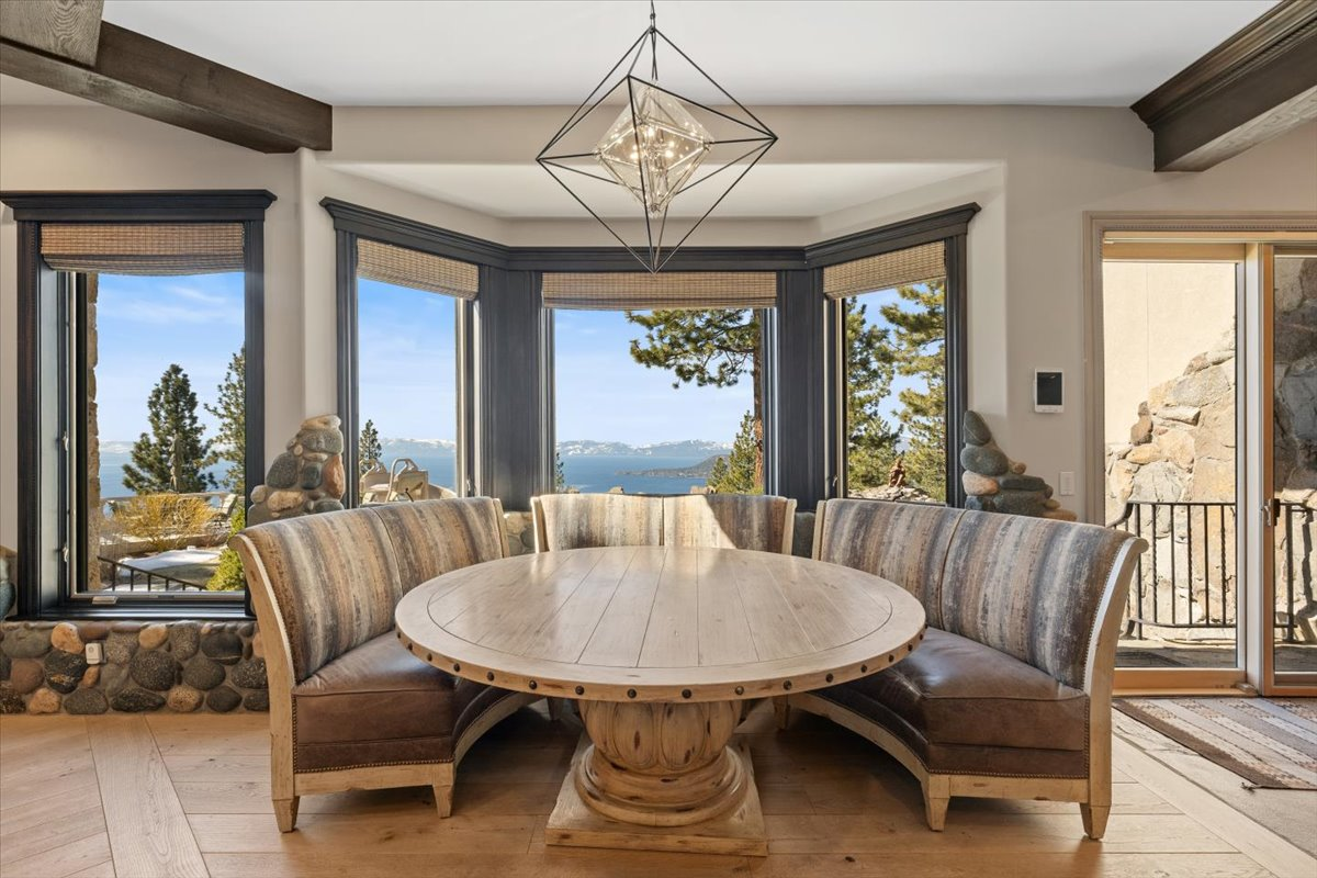 Just outside of the main workspace, a breakfast nook wraps around a curved banquette positioned to overlook Lake Tahoe through a wall of windows. 